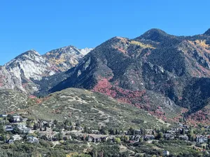 a view of a mountain range with houses in the foreground jigsaw puzzle