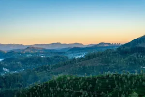 Vast green mountain range at sunrise with a clear sky. jigsaw puzzle