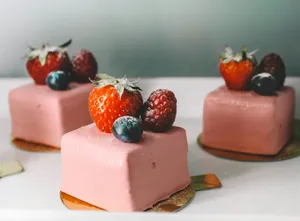 three square pastry with strawberries on top platter jigsaw puzzle