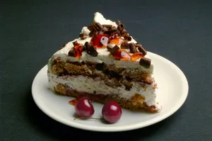sliced cake with cherry on white ceramic plate jigsaw puzzle