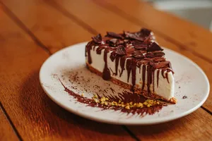 a piece of cake sitting on top of a white plate jigsaw puzzle