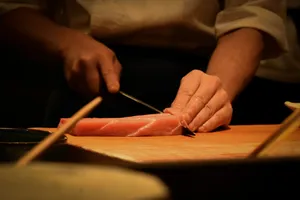 a person cutting up a piece of meat on a cutting board jigsaw puzzle