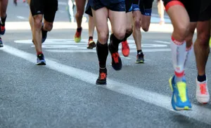 people running on gray asphalt road during daytime jigsaw puzzle
