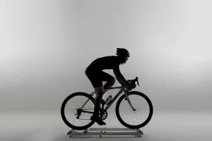 man in black shirt riding on white and orange bmx bike jigsaw puzzle