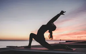 silhouette photography of woman doing yoga jigsaw puzzle