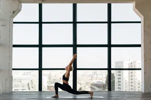 woman in black tank top and black leggings doing yoga jigsaw puzzle