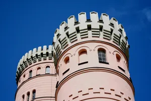 pink and white tower under blue cloudy sky jigsaw puzzle