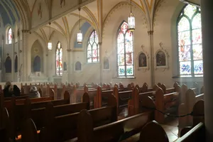 brown wooden chairs inside church jigsaw puzzle