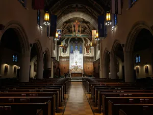 a church with pews and stained glass windows jigsaw puzzle