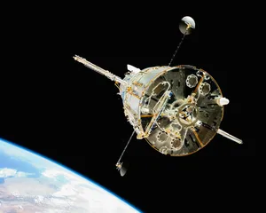 a satellite in orbit with the earth in the background jigsaw puzzle