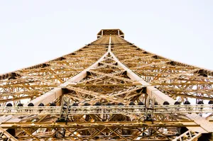 Low angle view of the Eiffel Tower showcasing its intricate steel structure from the base. jigsaw puzzle