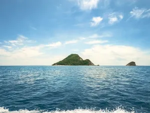 Breathtaking view of small islets surrounded by the Ionian Sea under a clear blue sky in Zakynthos, Greece. jigsaw puzzle