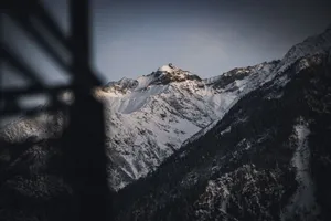 Stunning view of snow-covered Himalayan mountains captured at dusk, showcasing natural beauty and serenity. jigsaw puzzle