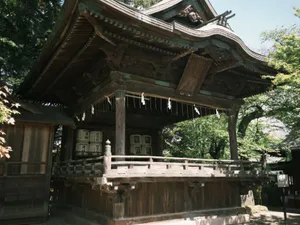 Classic Japanese shrine surrounded by nature, showcasing traditional architectural design. jigsaw puzzle