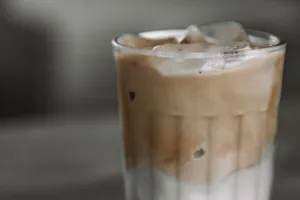 Close-up of a refreshing iced coffee in a glass, perfect for a summer day. jigsaw puzzle