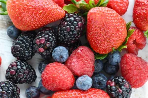 A vibrant close-up of fresh strawberries, raspberries, blackberries, and blueberries. jigsaw puzzle
