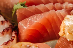 Appetizing close-up image showcasing a variety of fresh sushi and sashimi with vibrant colors and textures. jigsaw puzzle