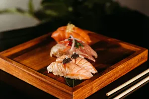 Close-up of assorted sushi on a wooden tray, featuring fresh salmon and caviar. jigsaw puzzle