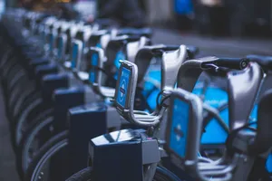 Row of bicycles at a public docking station for urban transportation. jigsaw puzzle