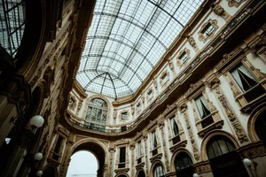 Explore the ornate architecture and glass-ceilinged grandeur of Milan's iconic shopping arcade. jigsaw puzzle