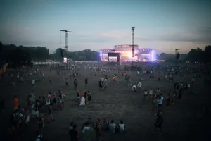 Vibrant outdoor concert scene with a lively crowd in Budapest during dusk. jigsaw puzzle
