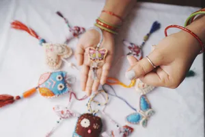 Vibrant handmade fabric ornaments including butterflies and hearts on display with hands holding them. jigsaw puzzle