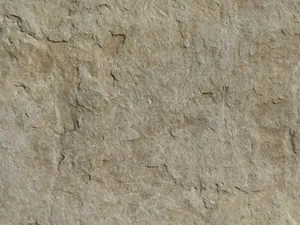 Close-up of a textured stone surface showing natural patterns and earthy tones. jigsaw puzzle