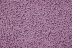 Detailed close-up of a pink textured wall surface creating a rough visual pattern. jigsaw puzzle