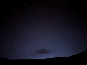 a night sky with stars and a few clouds jigsaw puzzle