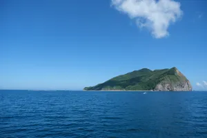 Green island surrounded by blue ocean water jigsaw puzzle