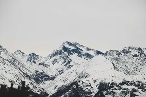 a mountain range covered in snow in the winter jigsaw puzzle