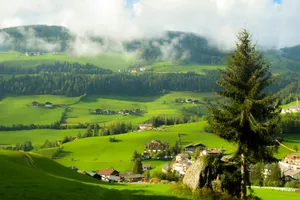 Green rolling hills with scattered houses and trees. jigsaw puzzle