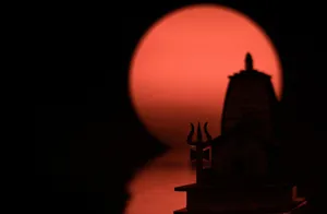 a silhouette of a building with a red sun in the background jigsaw puzzle