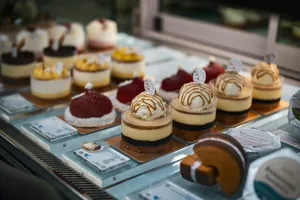a display case filled with different types of desserts jigsaw puzzle
