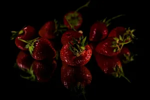 a group of strawberries sitting on top of a table jigsaw puzzle