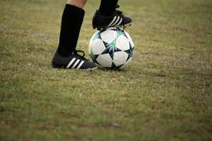 person playing soccer on field jigsaw puzzle