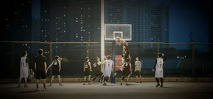 group of men playing basketball during nighttime jigsaw puzzle