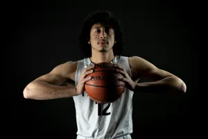man wearing white 12 jersey holding basketball with both hands jigsaw puzzle