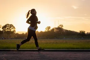 woman in black sports bra and black pants running on water during sunset jigsaw puzzle