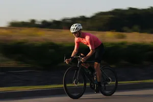 a man riding a bike down a curvy road jigsaw puzzle