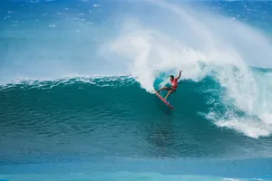 A man riding a wave on top of a surfboard jigsaw puzzle