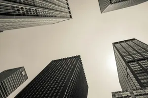 low angle and grayscale photography of high-rise buildings jigsaw puzzle