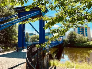 blue bridge across river jigsaw puzzle