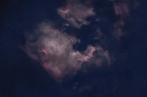 A nebula glows beautifully in the night sky. jigsaw puzzle