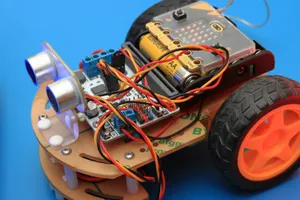 a small robot car with wheels and wires attached to it jigsaw puzzle