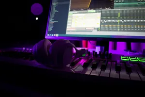 Headphones rest on a music production keyboard. jigsaw puzzle