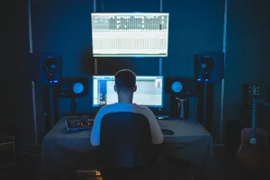 man sitting in front of computer jigsaw puzzle