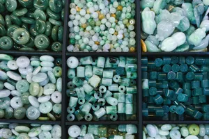 Assortment of green and white jade beads in compartments jigsaw puzzle