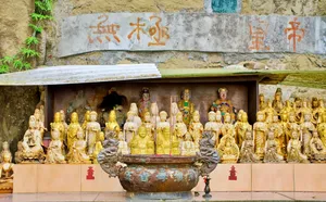 Ornate golden statues in a traditional Taiwanese temple shrine with intricate details and calligraphy. jigsaw puzzle