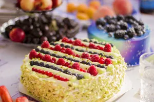 Vibrant fruit-topped and marbled cakes on table, perfect for food photography needs. jigsaw puzzle